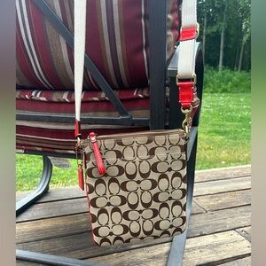 Classic signature canvas small crossbody bag.